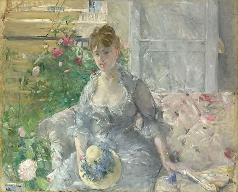 Young Woman Seated on a Sofa