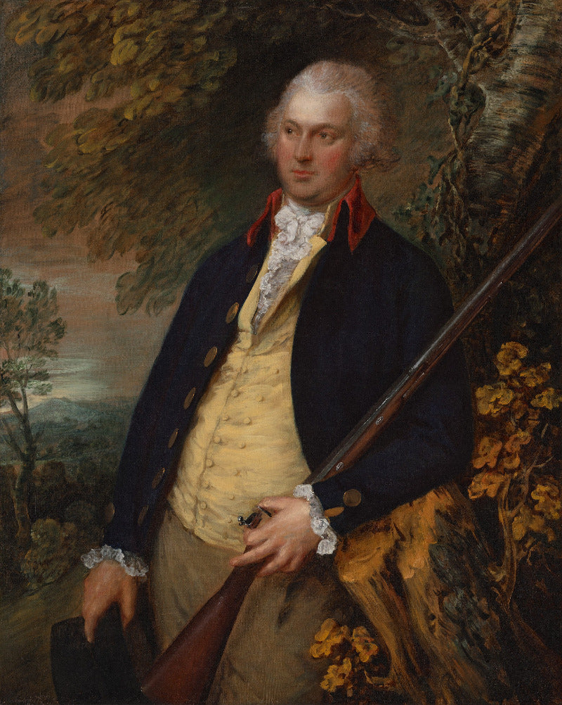 Portrait of a man in formal attire holding a rifle, with a natural landscape in the background.