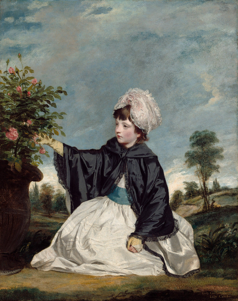 Portrait of a young girl in a garden with flowers and landscape in the background