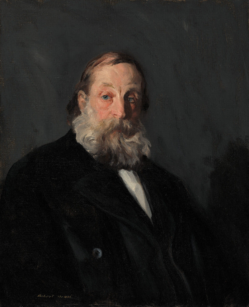 Portrait of a man with a white beard and dark coat against a dark background