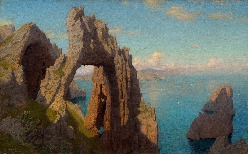 Rocks with natural arch over a body of water
